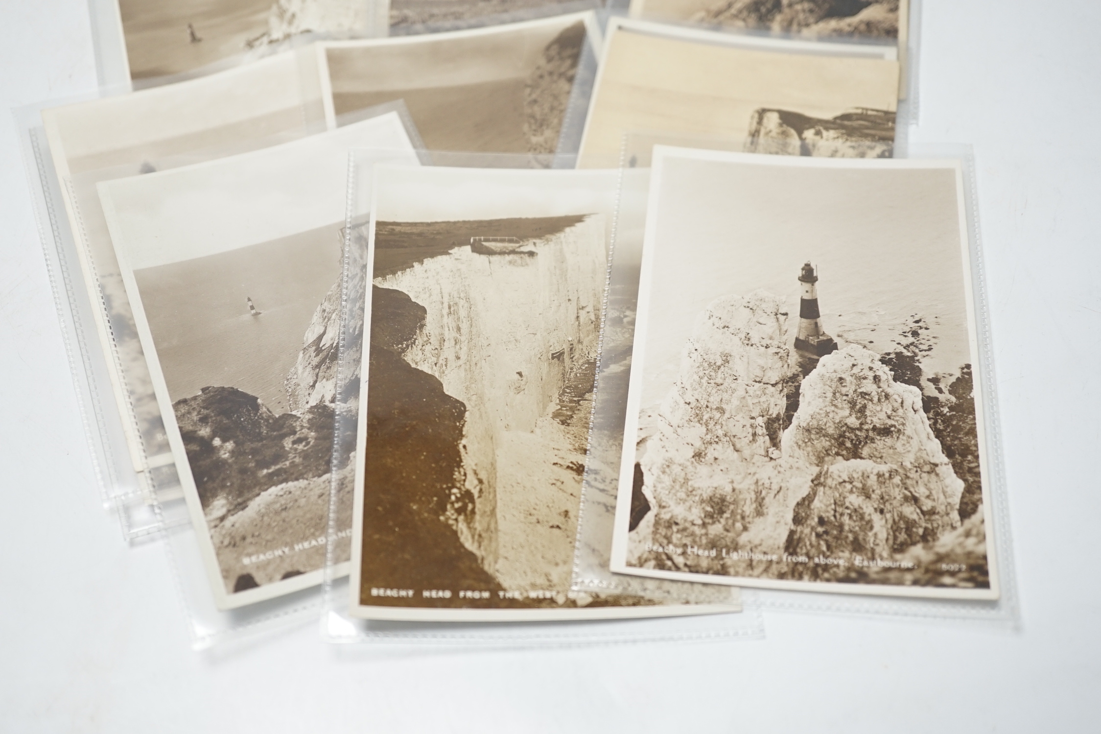 A large quantity of early to mid 20th century postcards of Eastbourne and the surrounding area, all in individual protective sleeves (in two boxes)